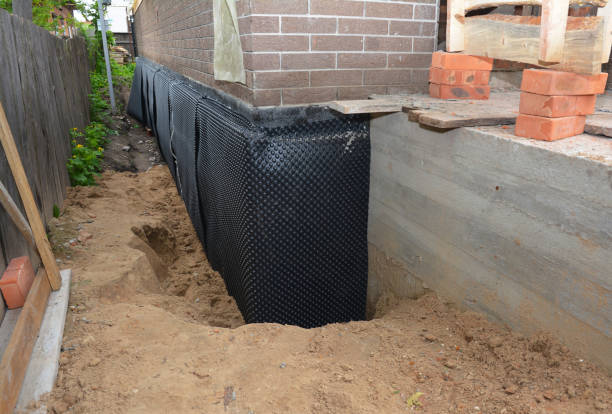 Happy homeowners after waterproofing job in Odenville